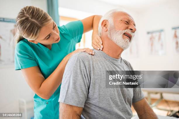 physiotherapist working - neck stretch stock pictures, royalty-free photos & images