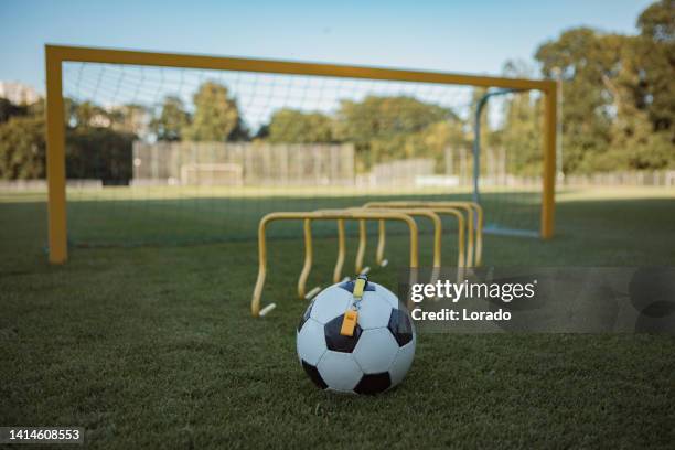 football equipment on a sports soccer field - sports training drill stock pictures, royalty-free photos & images