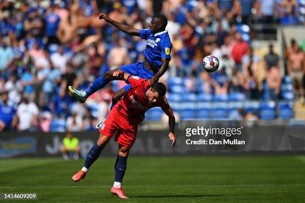 Maxime Colin of Birmingham City and Jamilu Collins of Cardiff City compete for the ball during the Sky Bet Championship between Cardiff City and...