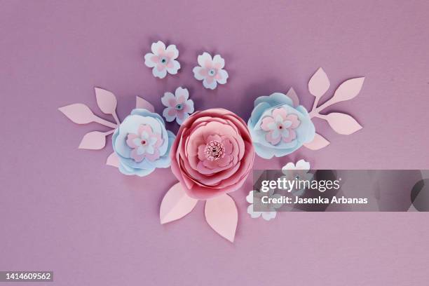 paper flowers on the violet background - paper flower stock pictures, royalty-free photos & images