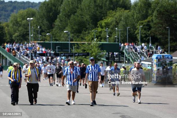 Fans of Brighton & Hove Albion make their way towards the stadium prior to the Premier League match between Brighton & Hove Albion and Newcastle...