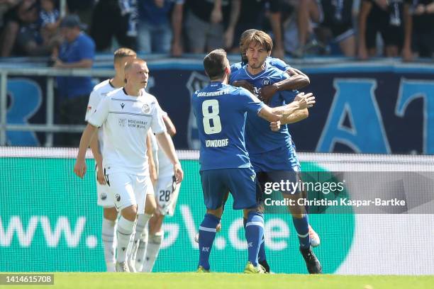 Simone Rapp of Karlsruher SC celebrates after scoring his team`s second goal with teammates during the Second Bundesliga match between Karlsruher SC...