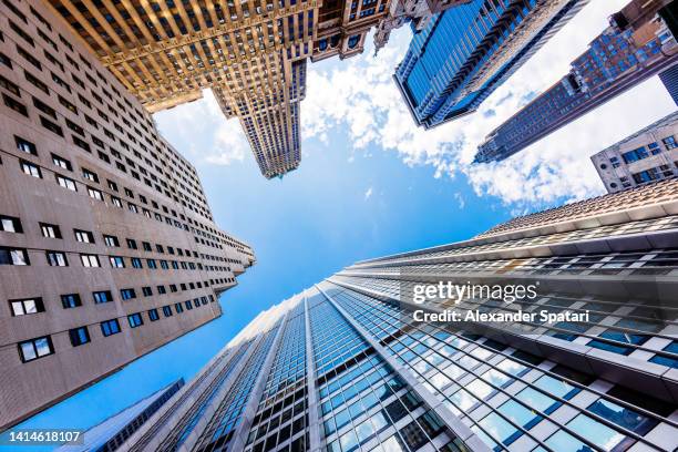 skyscrapers in manhattan financial district, low angle view, new york city, usa - new york stock exchange stockfoto's en -beelden