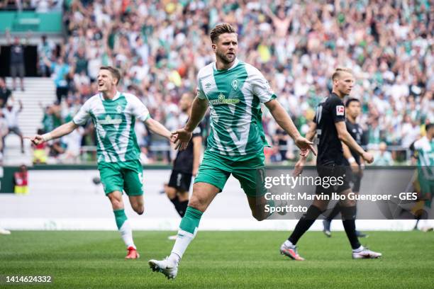 Niclas Fuellkrug of Bremen celebrates after scoring his team's first goal during the Bundesliga match between SV Werder Bremen and VfB Stuttgart at...