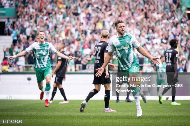 Niclas Fuellkrug of Bremen celebrates after scoring his team's first goal during the Bundesliga match between SV Werder Bremen and VfB Stuttgart at...