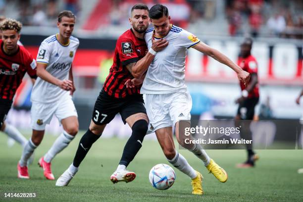 Pascal Trestroet of FC Ingolstadt 04 challenges Marvin Cuin of FC Saarbrücken during the 3. Liga match between FC Ingolstadt 04 and 1. FC Saarbrücken...