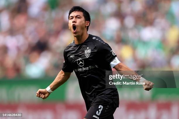 Wataru Endo of VfB Stuttgart celebrates after scoring their side's first goal during the Bundesliga match between SV Werder Bremen and VfB Stuttgart...