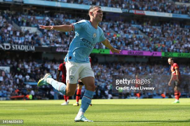 Phil Foden of Manchester City celebrates after scoring their sides third goal during the Premier League match between Manchester City and AFC...