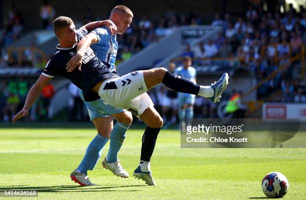 Charlie Cresswell of Millwall and Jake Bidwell of Coventry City battle for the ball during the Sky Bet Championship between Millwall and Coventry...