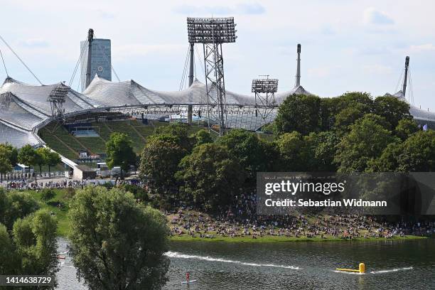 General view as spectators watch on outside the Olympiastadion as athletes compete in the swimming stage during the Elite Men's Triathlon competition...