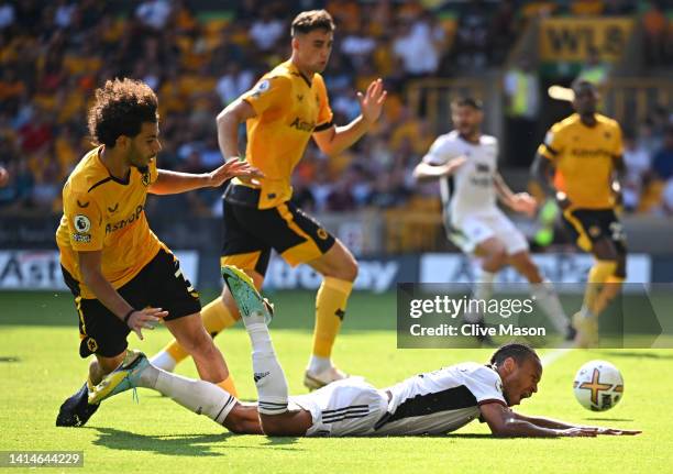 Bobby Reid of Fulham is fouled by Rayan Ait-Nouri of Wolverhampton Wanderers leading to a penalty being awarded during the Premier League match...