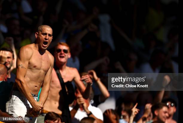 Millwall fans celebrate in the stands during the Sky Bet Championship between Millwall and Coventry City at The Den on August 13, 2022 in London,...