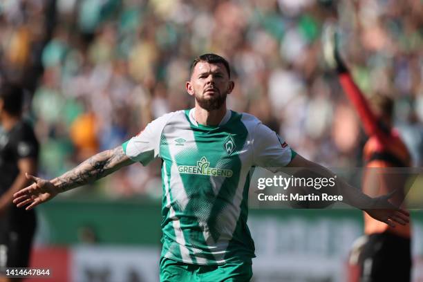 Oliver Burke of SV Werder Bremen celebrates after scoring their sides second goal during the Bundesliga match between SV Werder Bremen and VfB...