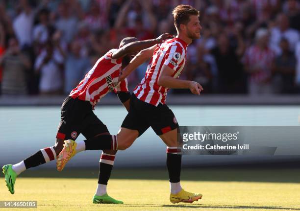 Mathias Jensen of Brentford celebrates after scoring their sides second goal during the Premier League match between Brentford FC and Manchester...
