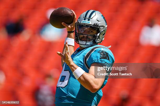 Baker Mayfield of the Carolina Panthers attempts a pass before the preseason game against the Washington Commanders at FedExField on August 13, 2022...