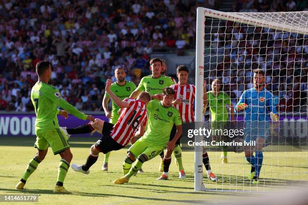 Ben Mee of Brentford scores their sides third goal during the Premier League match between Brentford FC and Manchester United at Brentford Community...