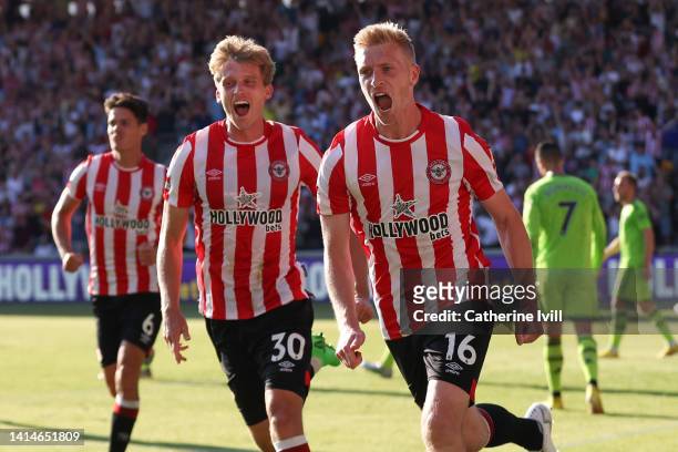 Ben Mee of Brentford celebrates after scoring their sides third goal during the Premier League match between Brentford FC and Manchester United at...