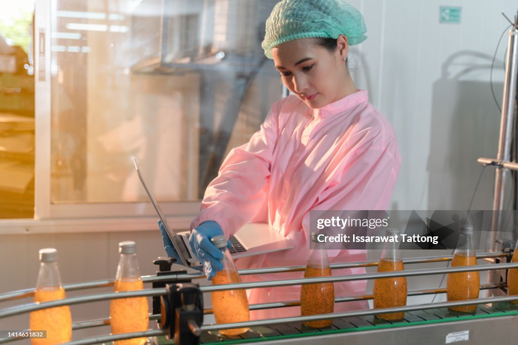Women employee working in beverage factory, Woman factory manager