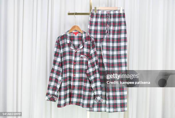 pajamas hanging in home - pyjamas stock pictures, royalty-free photos & images