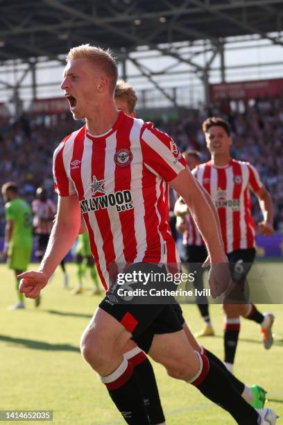 Ben Mee of Brentford celebrates after scoring their sides third goal during the Premier League match between Brentford FC and Manchester United at...