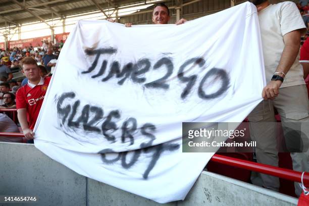Banner reading 'Time 2 Go Glazers Out' is seen during the Premier League match between Brentford FC and Manchester United at Brentford Community...