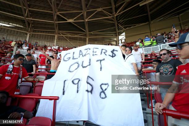 Banner reading 'Glazers Out 1958' is seen during the Premier League match between Brentford FC and Manchester United at Brentford Community Stadium...