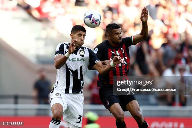 Adam Masina of Udinese Calcio and of AC Milan battle for the ball during the Serie A match between AC MIlan and Udinese Calcio at Stadio Giuseppe...