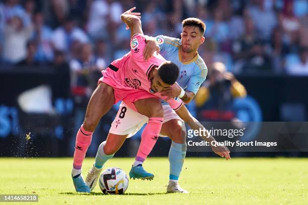 Fran Beltran of RC Celta competes for the ball with Oscar Gil of RCD Espanyol during the LaLiga Santander match between RC Celta and RCD Espanyol at...