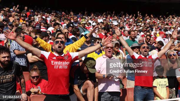 Arsenal fans show their support during the Premier League match between Arsenal FC and Leicester City at Emirates Stadium on August 13, 2022 in...