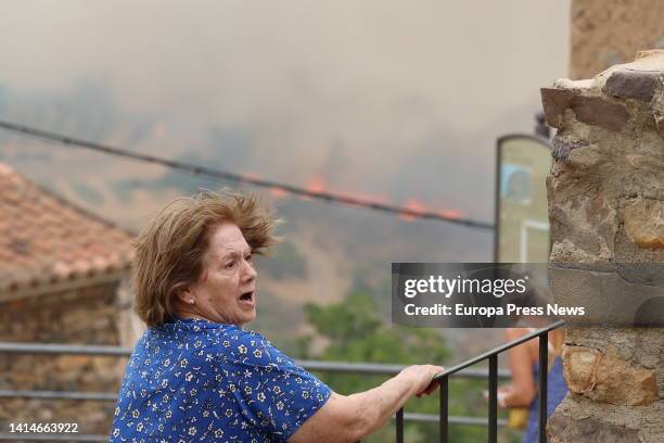 Residents watch the fire from a distance on August 13 in Añon de Moncayo, Zaragoza, Aragon, Spain. A fire declared this Saturday in the municipality...