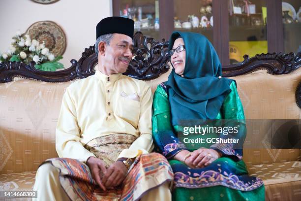 portrait of a senior malaysian couple - islamabad stock pictures, royalty-free photos & images