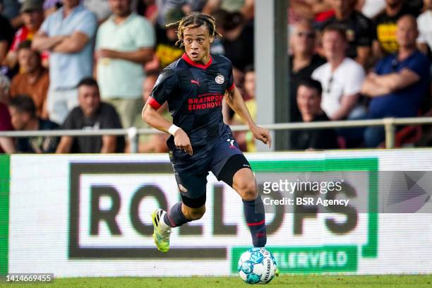Xavi Simons of PSV dribbles with the ball during the Dutch Eredivisie match between Go Ahead Eagles and PSV at De Adelaarshorst on August 13, 2022 in...
