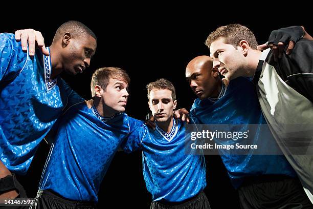 soccer team planning game in huddle - soccer huddle stock pictures, royalty-free photos & images