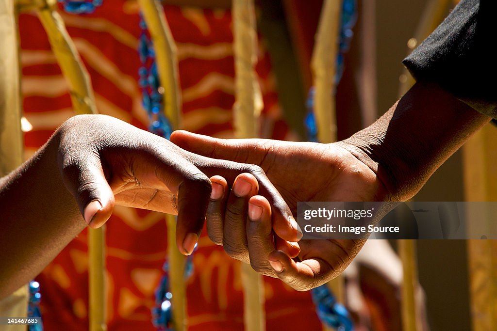 Close up of couple holding hands