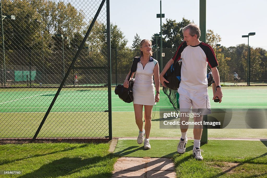 Couple walking to tennis courts