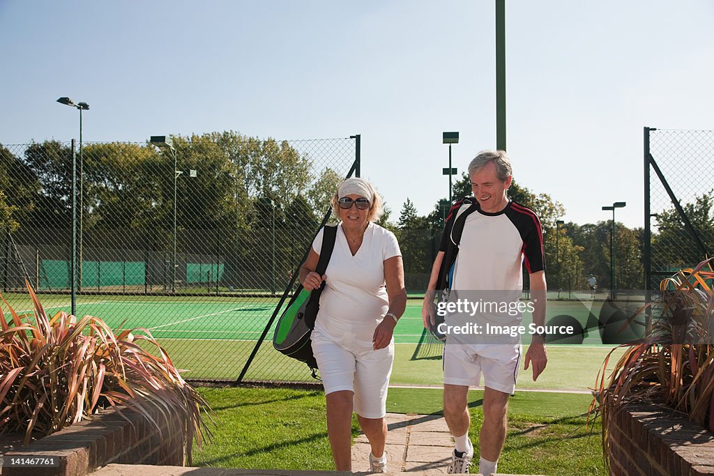 Couple walking to tennis courts