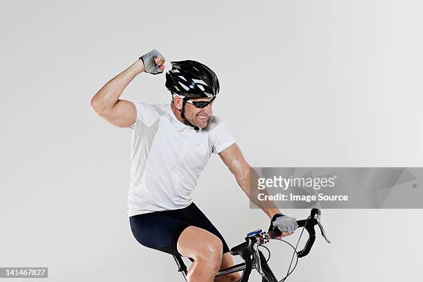 male cyclist cheering - cycling race stock pictures, royalty-free photos & images