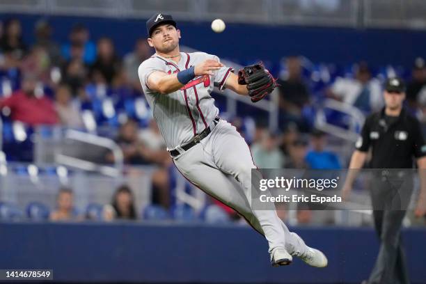 Austin Riley of the Atlanta Braves throws towards first base during the first inning against the Miami Marlins at loanDepot park on August 13, 2022...