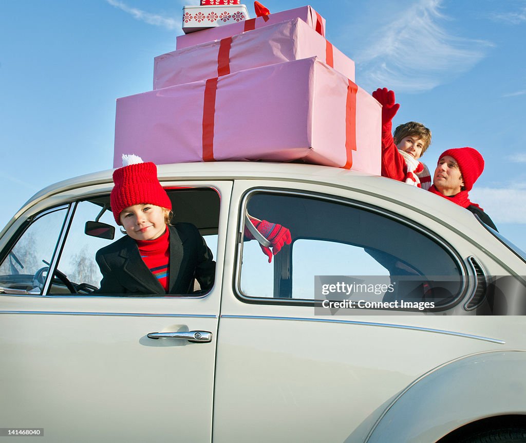 Family car with presents balanced on the roof
