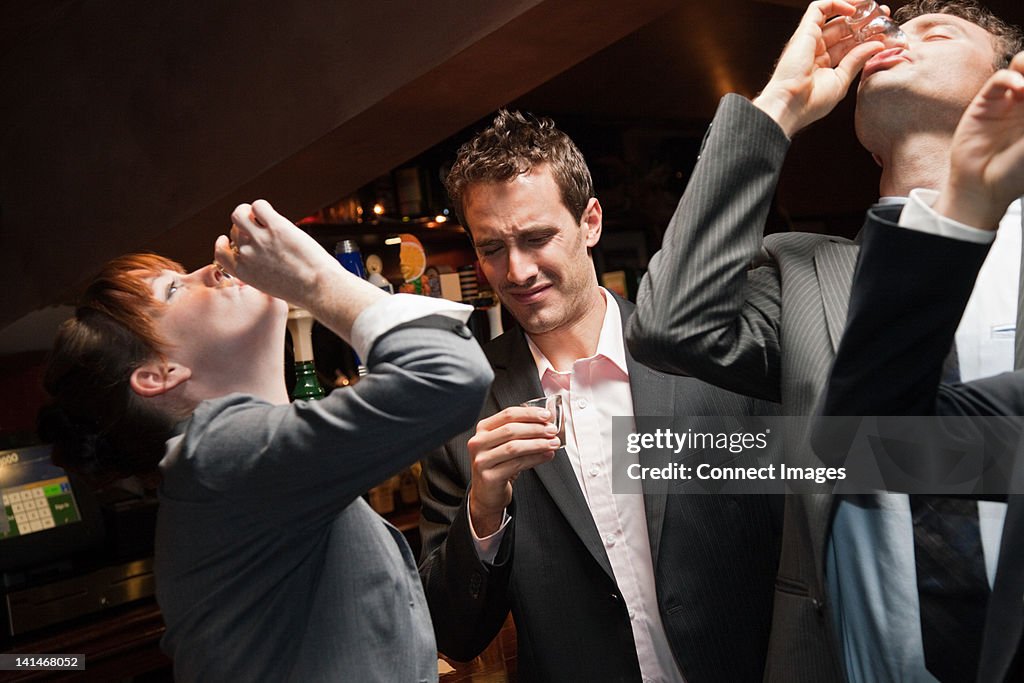 Businesspeople drinking at a bar