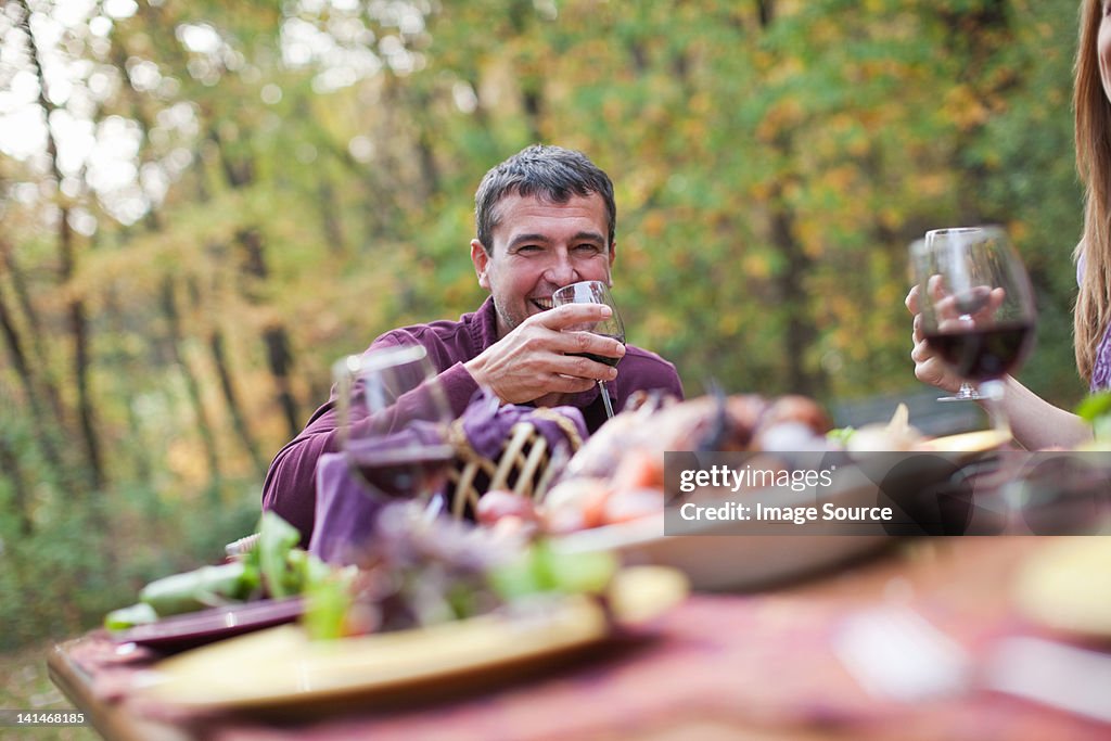 Mature man at outdoor dinner