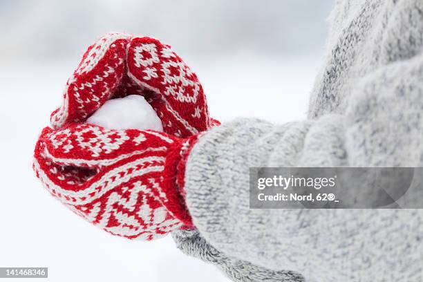 person making snowball - mitten stock pictures, royalty-free photos & images