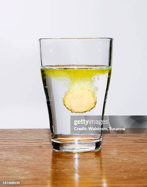 tablet dissolving in glass of water - effervescent tablet stock pictures, royalty-free photos & images