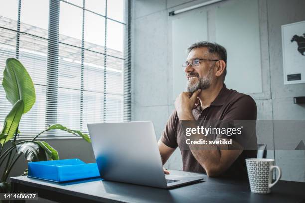 man working at modern office space - quarantaine stock pictures, royalty-free photos & images