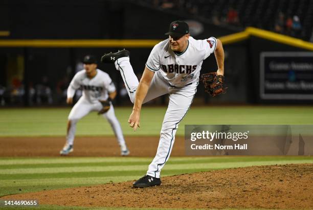 Mark Melancon of the Arizona Diamondbacks delivers a pitch against the Pittsburgh Pirates at Chase Field on August 09, 2022 in Phoenix, Arizona.