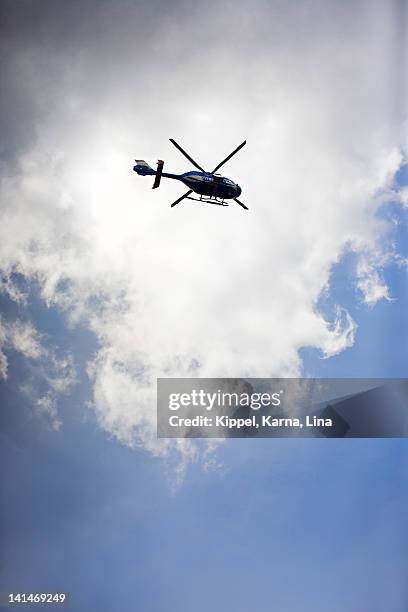 helicopter against sky, low angle view - helikopter bildbanksfoton och bilder