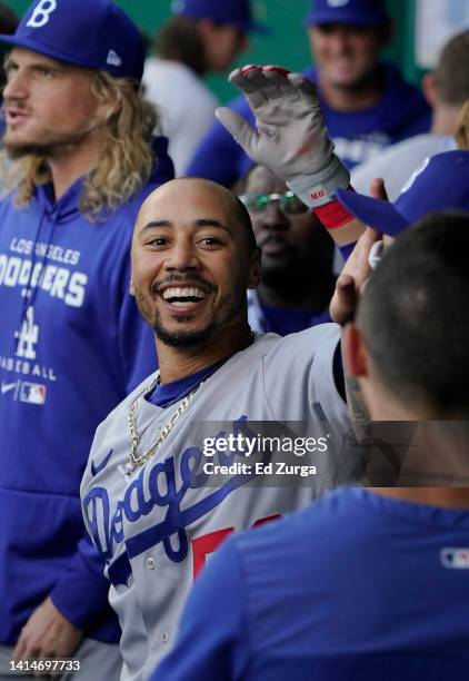 Mookie Betts of the Los Angeles Dodgers celebrates his home run with teammates in the first inning against the Kansas City Royals at Kauffman Stadium...