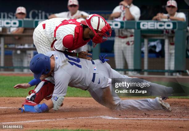 Justin Turner of the Los Angeles Dodgers is tagged out by catcher MJ Melendez of the Kansas City Royals as he tries to score in the first inning at...