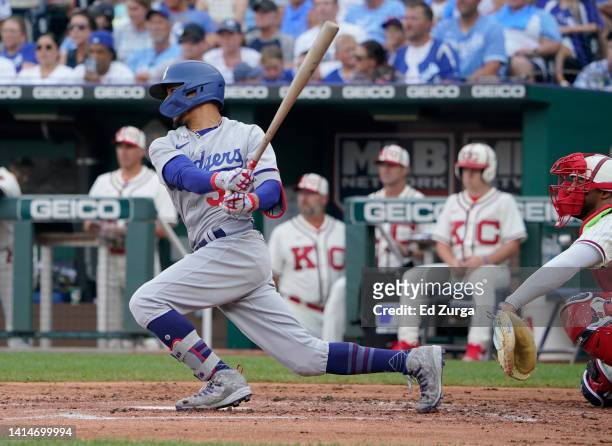 Mookie Betts of the Los Angeles Dodgers hits a single in the second inning against the Kansas City Royals at Kauffman Stadium on August 13, 2022 in...