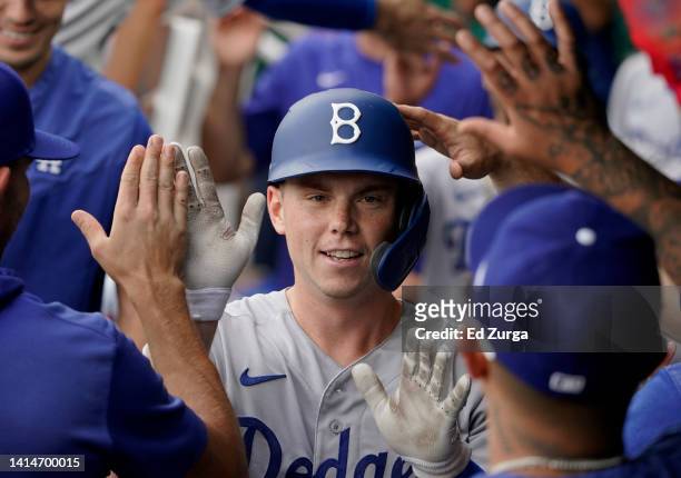 Will Smith of the Los Angeles Dodgers is congratulated by teammates after hitting a two-run home run in the second inning against the Kansas City...